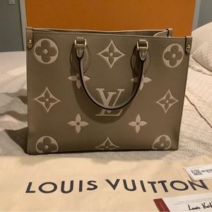 Louis Vuitton On The Go MM in Dove/Cream Empreinte Leather